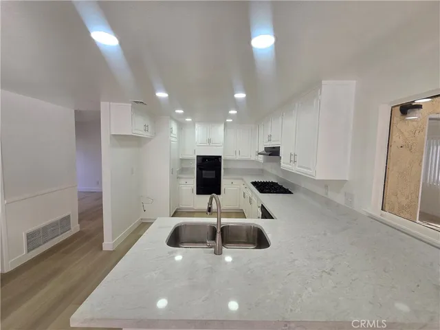 a lobby with a couch and a rug