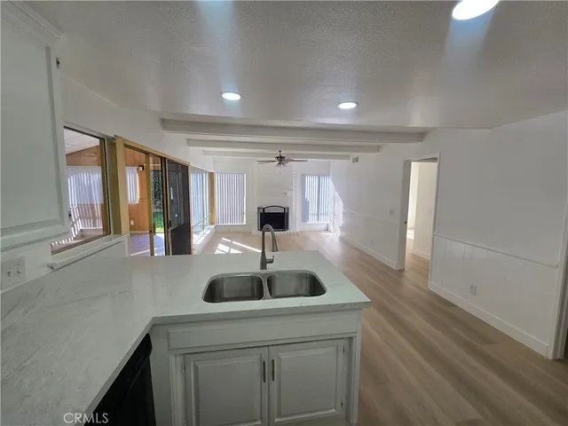 a kitchen with stainless steel appliances a sink and cabinets