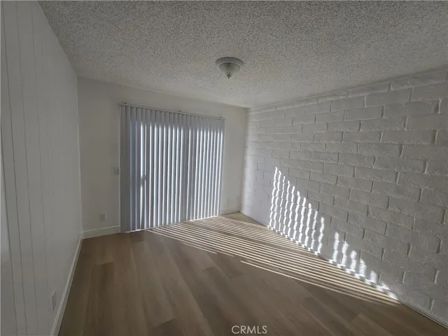 a view of a livingroom with wooden floor