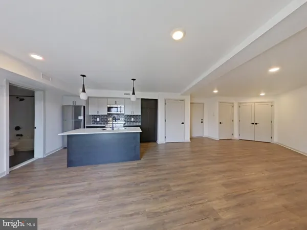 a view of kitchen and kitchen with granite countertop