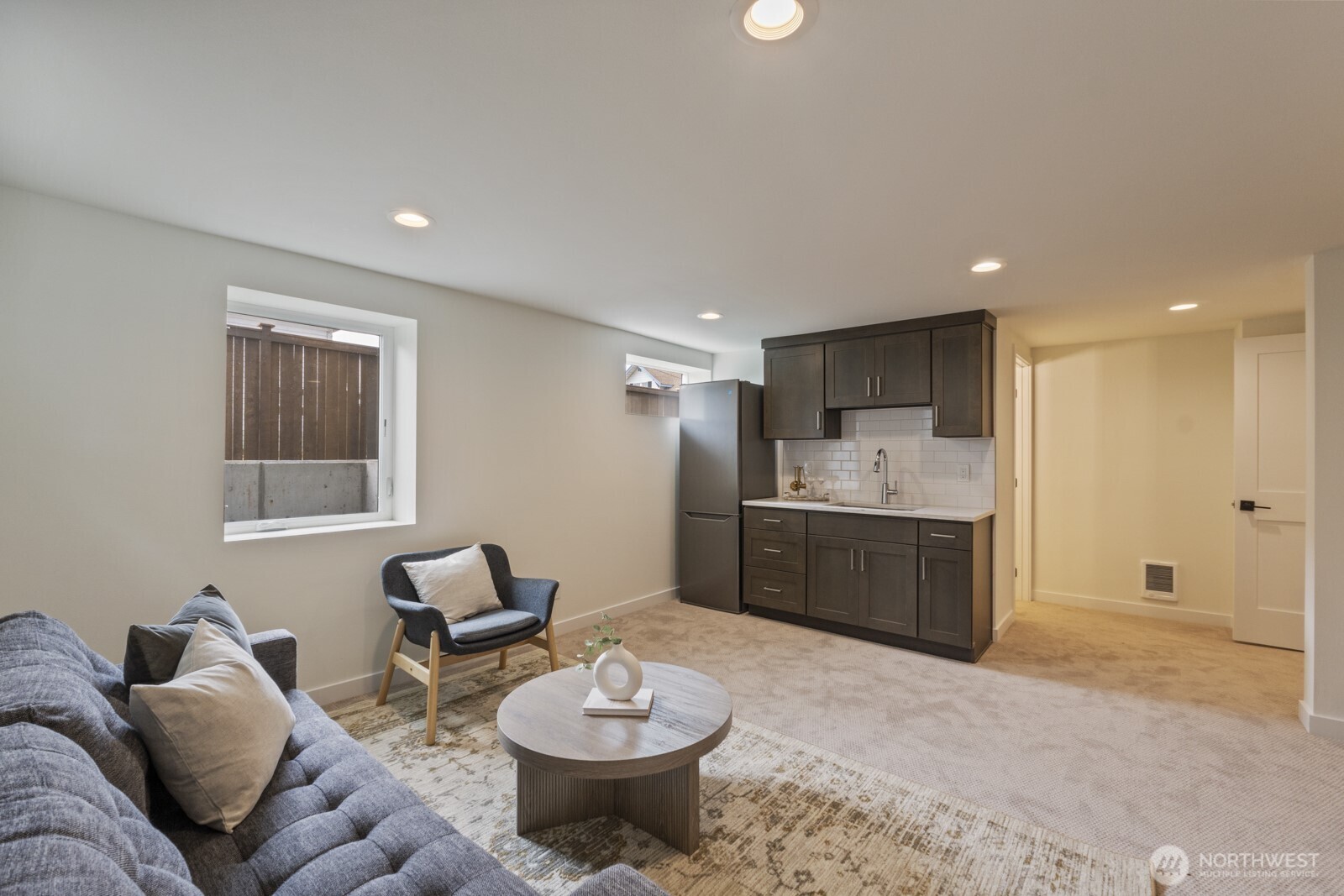 101 North 51st Street Seattle, WA 98103 - Photo 12 of 38 a kitchen with a refrigerator and a sink