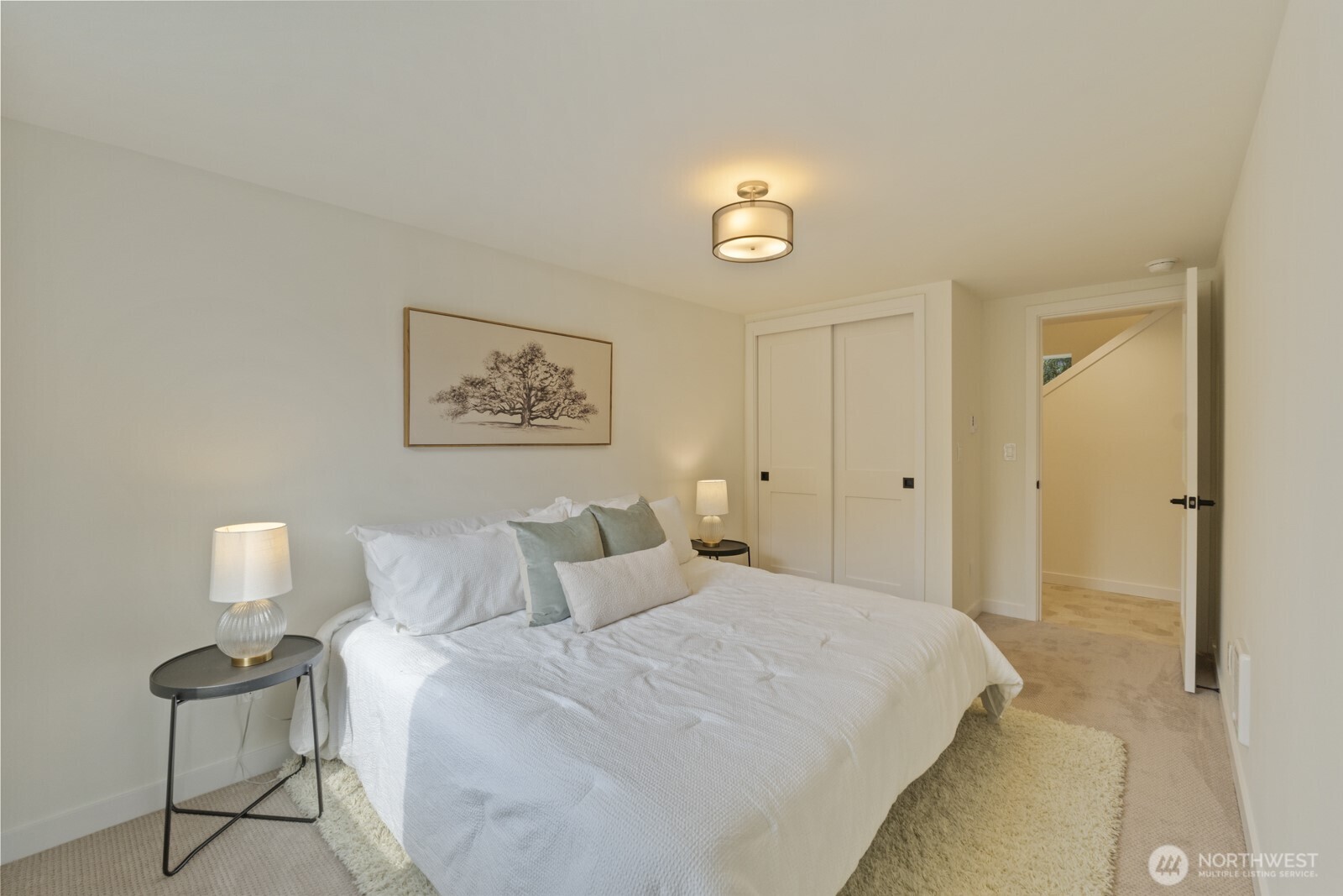 101 North 51st Street Seattle, WA 98103 - Photo 18 of 38 a bedroom with a bed and a lamp on table