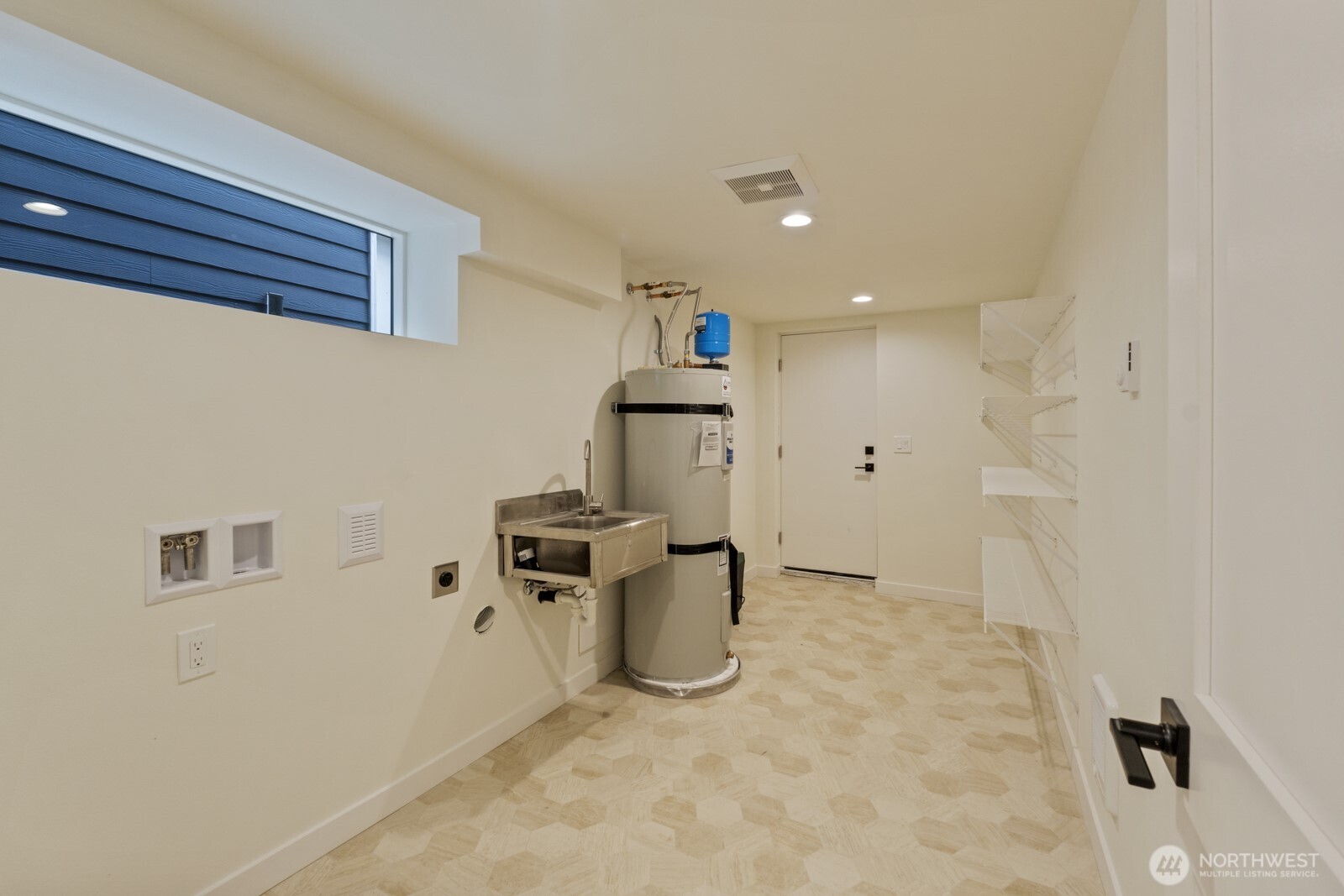 101 North 51st Street Seattle, WA 98103 - Photo 19 of 38 a view of a storage & utility room with a sink