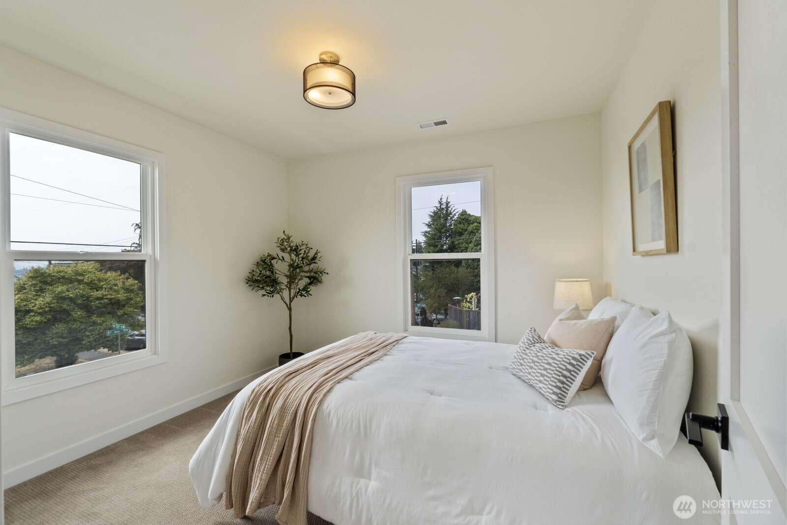 101 North 51st Street Seattle, WA 98103 - Photo 23 of 38 a bedroom with a bed and a window