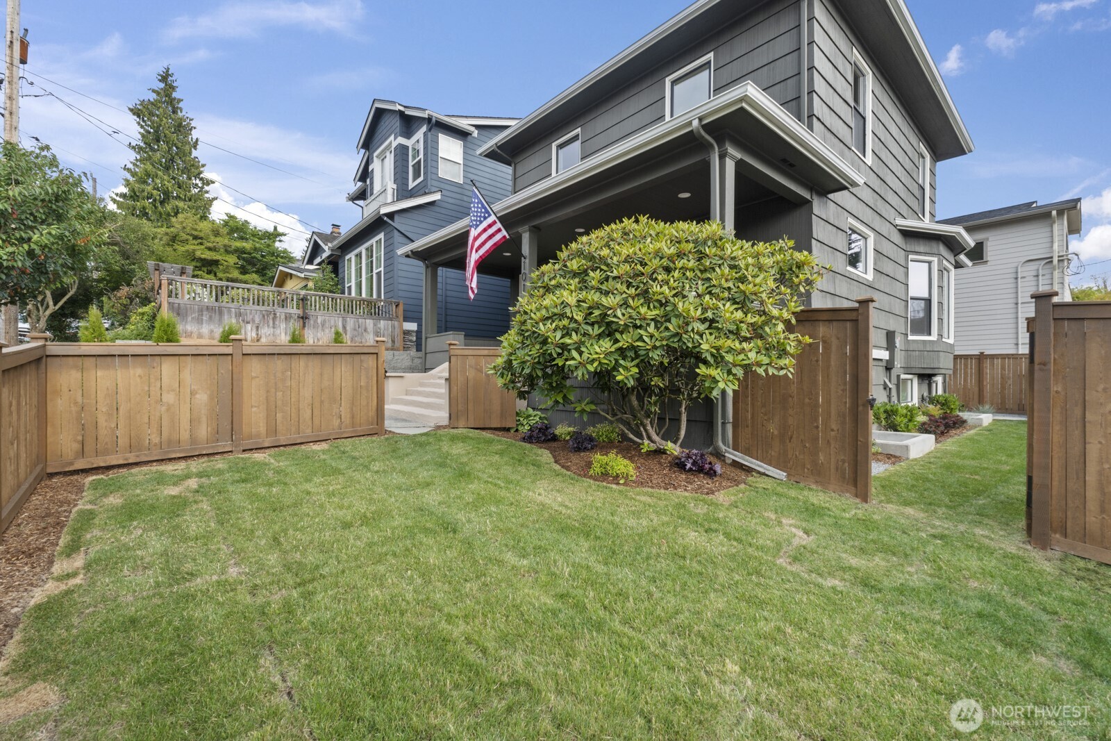 101 North 51st Street Seattle, WA 98103 - Photo 28 of 38 a front view of a house with a yard