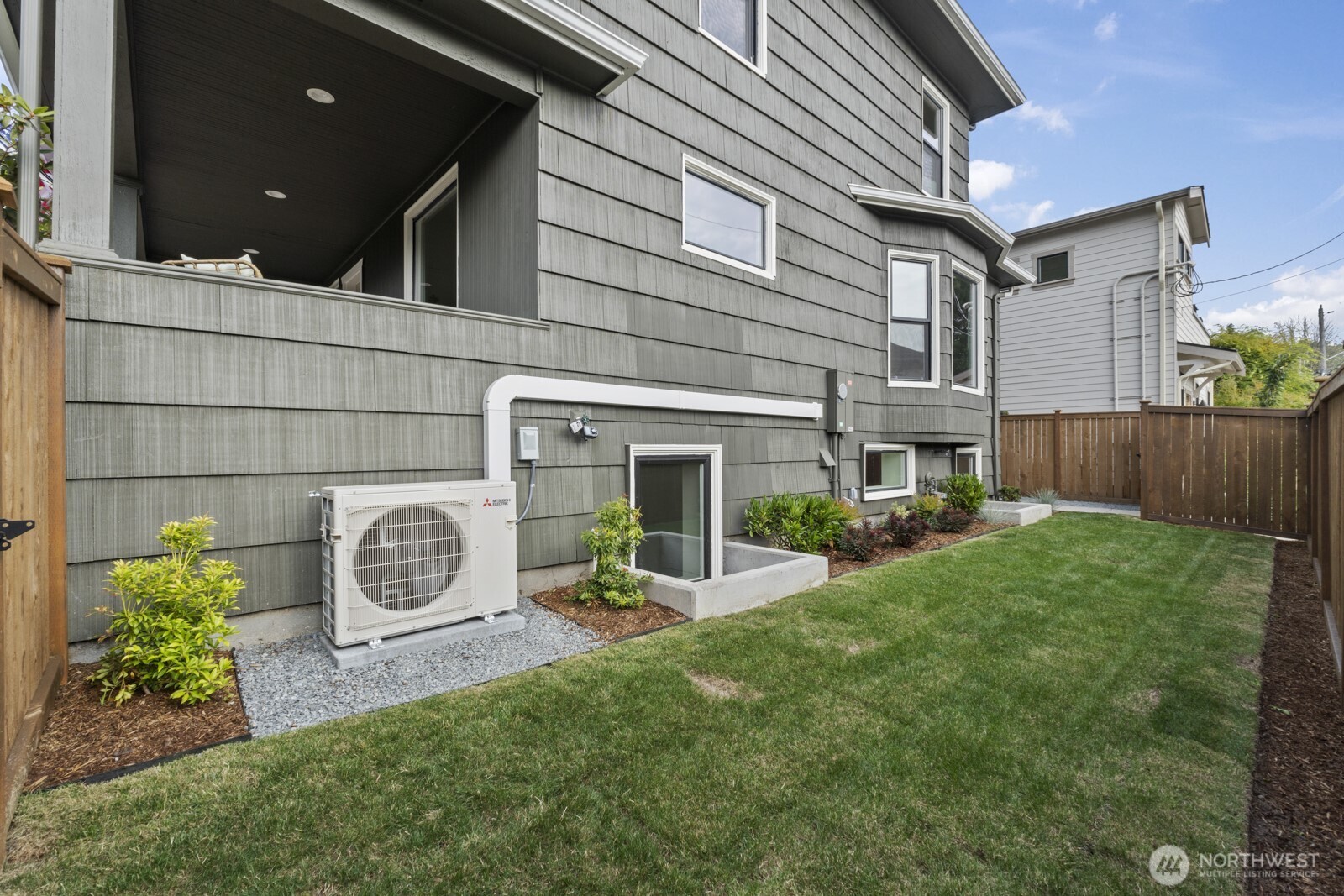 101 North 51st Street Seattle, WA 98103 - Photo 29 of 38 a view of a house with backyard and porch