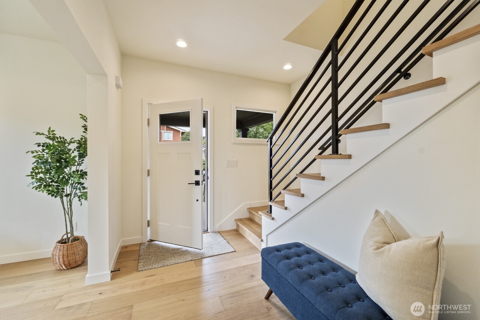101 North 51st Street Seattle, WA 98103 - Photo 6 of 38 a view of entryway and hall with wooden floor