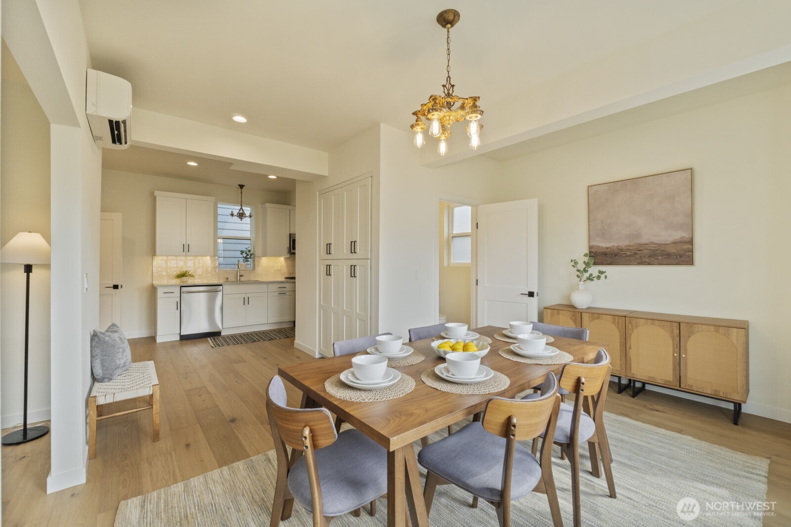 101 North 51st Street Seattle, WA 98103 - Photo 10 of 38 a view of a dining room and livingroom with furniture wooden floor a chandelier