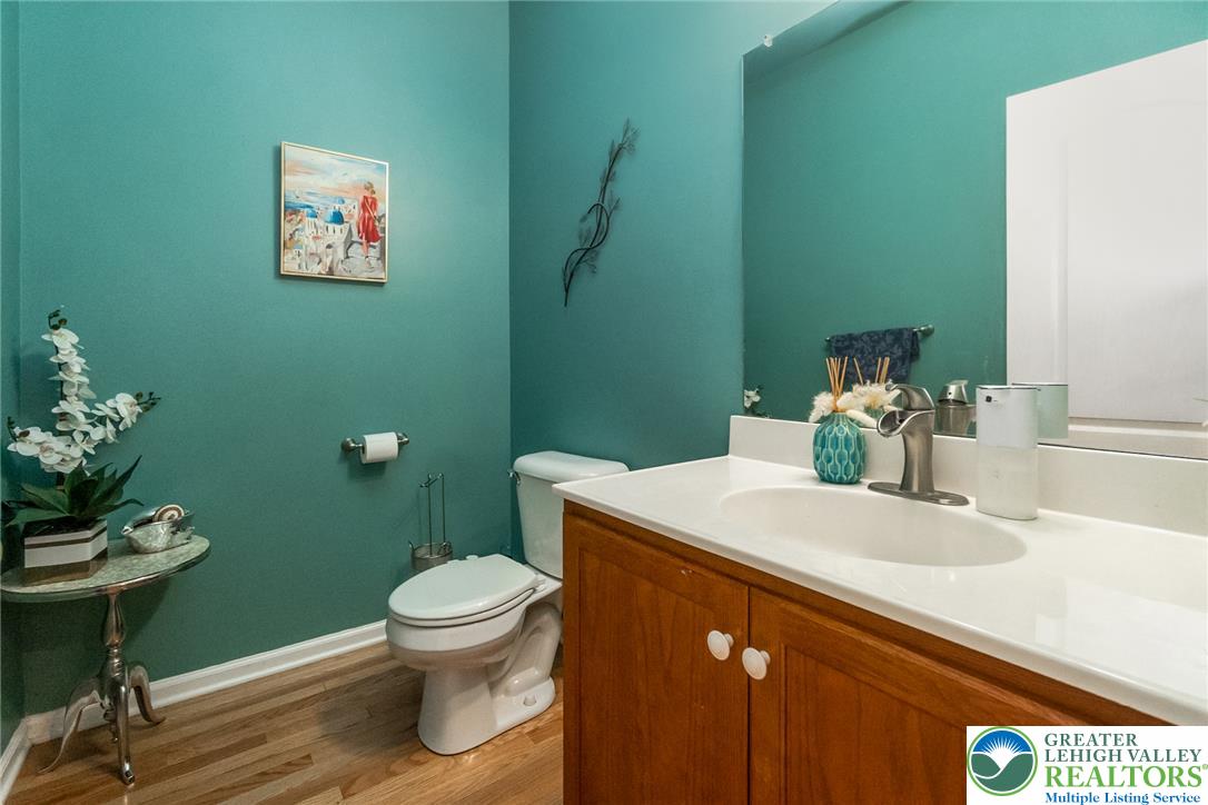 3566 Penfield Way Nazareth, PA 18064 - Photo 26 of 47 A well-appointed powder room features hardwood flooring and a stylish vanity with ample storage.