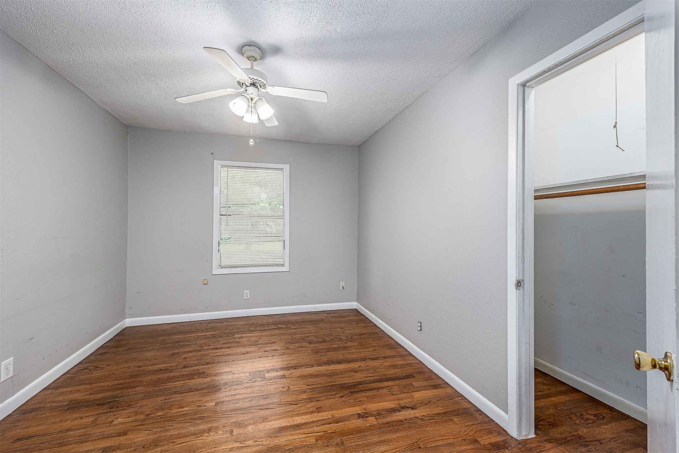 502 Massey Tompkins Road Baytown, TX 77521 - Photo 15 of 32 a view of an empty room with wooden floor and a window