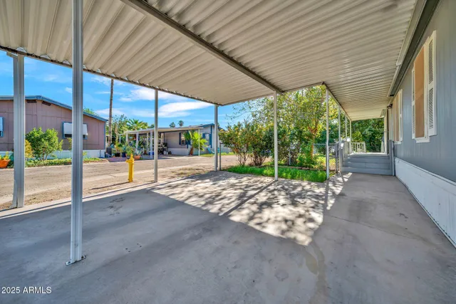 a view of a livingroom with wooden floor and window