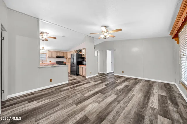 a view of backyard with large trees and a stairs