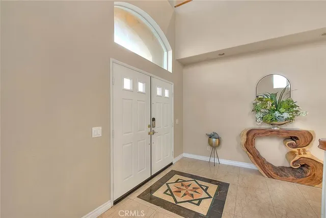a view of an entryway with wooden floor