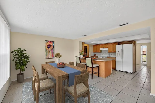 a dining room with a table and chairs