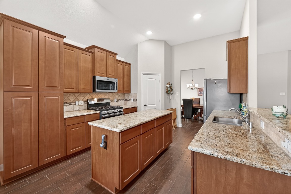 2719 Intrepid Trail Rosenberg, TX 77471 - Photo 21 of 50 a kitchen with a sink stove and refrigerator
