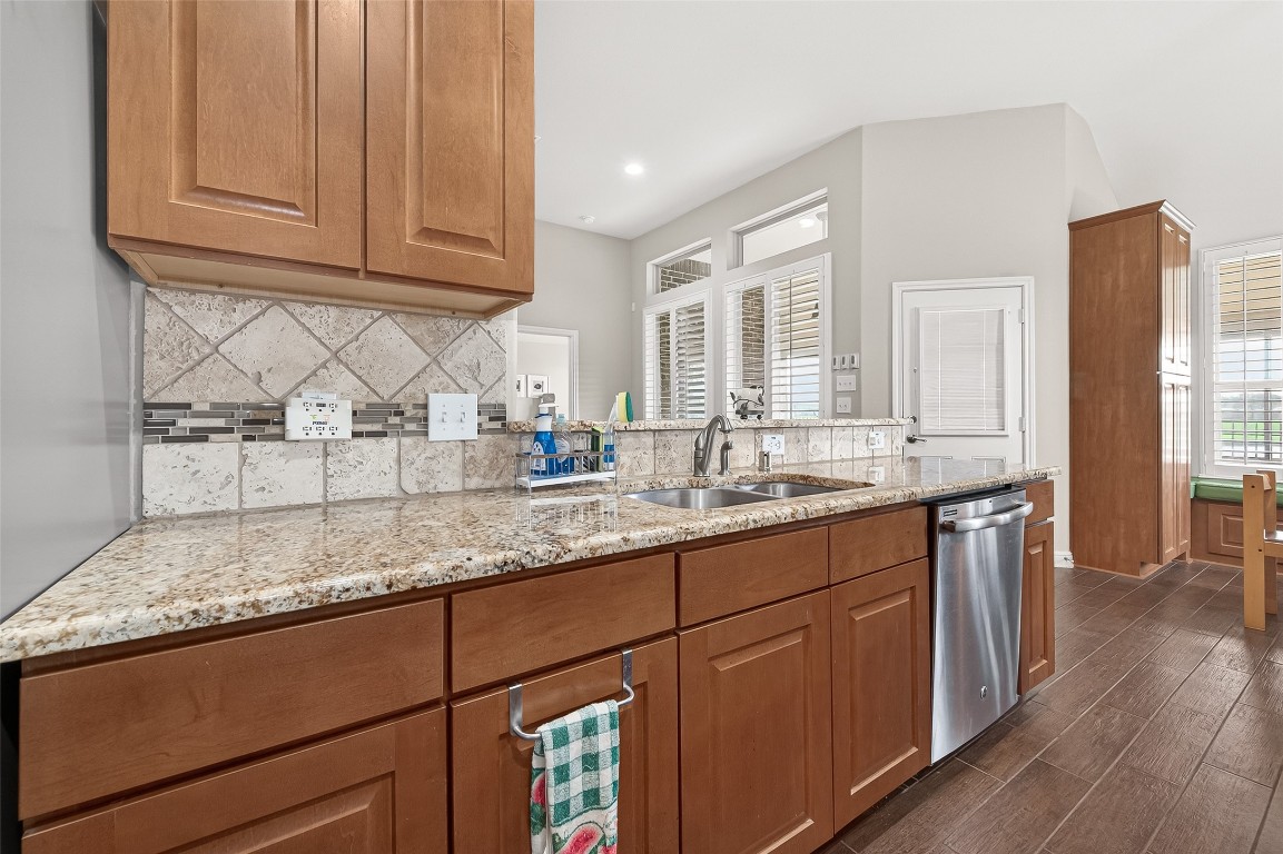 2719 Intrepid Trail Rosenberg, TX 77471 - Photo 22 of 50 a kitchen with granite countertop stainless steel appliances sink and cabinets