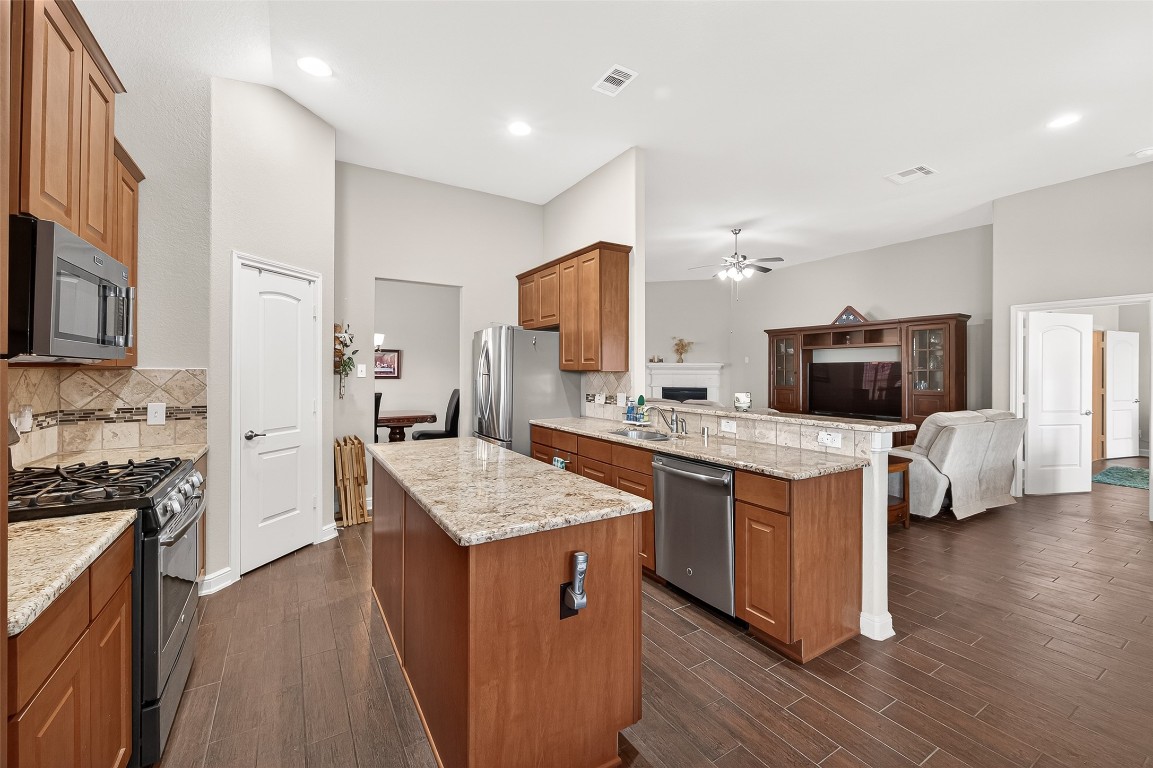 2719 Intrepid Trail Rosenberg, TX 77471 - Photo 25 of 50 a kitchen with a sink stove and refrigerator