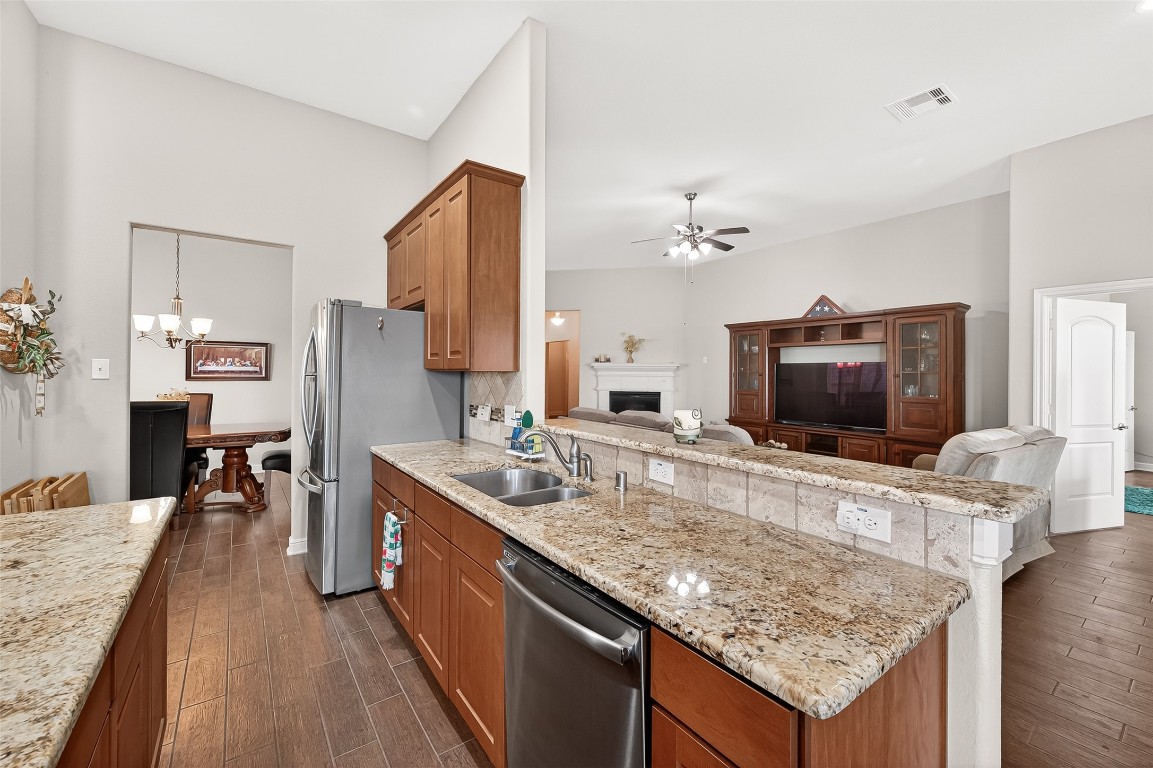 2719 Intrepid Trail Rosenberg, TX 77471 - Photo 26 of 50 a living room with granite countertop furniture and a flat screen tv