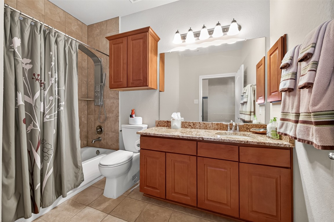 2719 Intrepid Trail Rosenberg, TX 77471 - Photo 28 of 50 a bathroom with a toilet sink and mirror