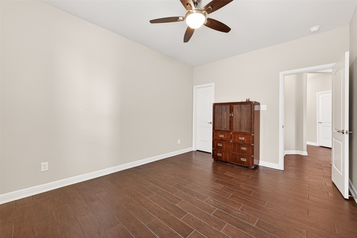2719 Intrepid Trail Rosenberg, TX 77471 - Photo 32 of 50 an empty room with wooden floor and windows