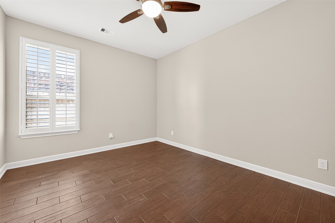 2719 Intrepid Trail Rosenberg, TX 77471 - Photo 33 of 50 an empty room with a window and a ceiling fan