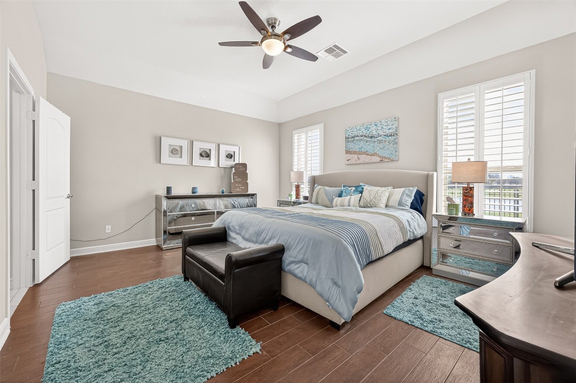 2719 Intrepid Trail Rosenberg, TX 77471 - Photo 34 of 50 a spacious bedroom with a bed a couch and a window