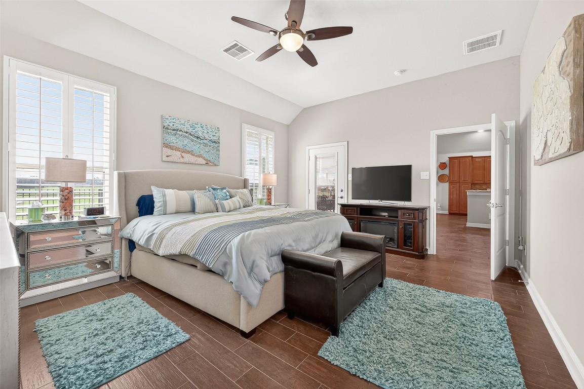 2719 Intrepid Trail Rosenberg, TX 77471 - Photo 35 of 50 a spacious bedroom with a bed and a couch