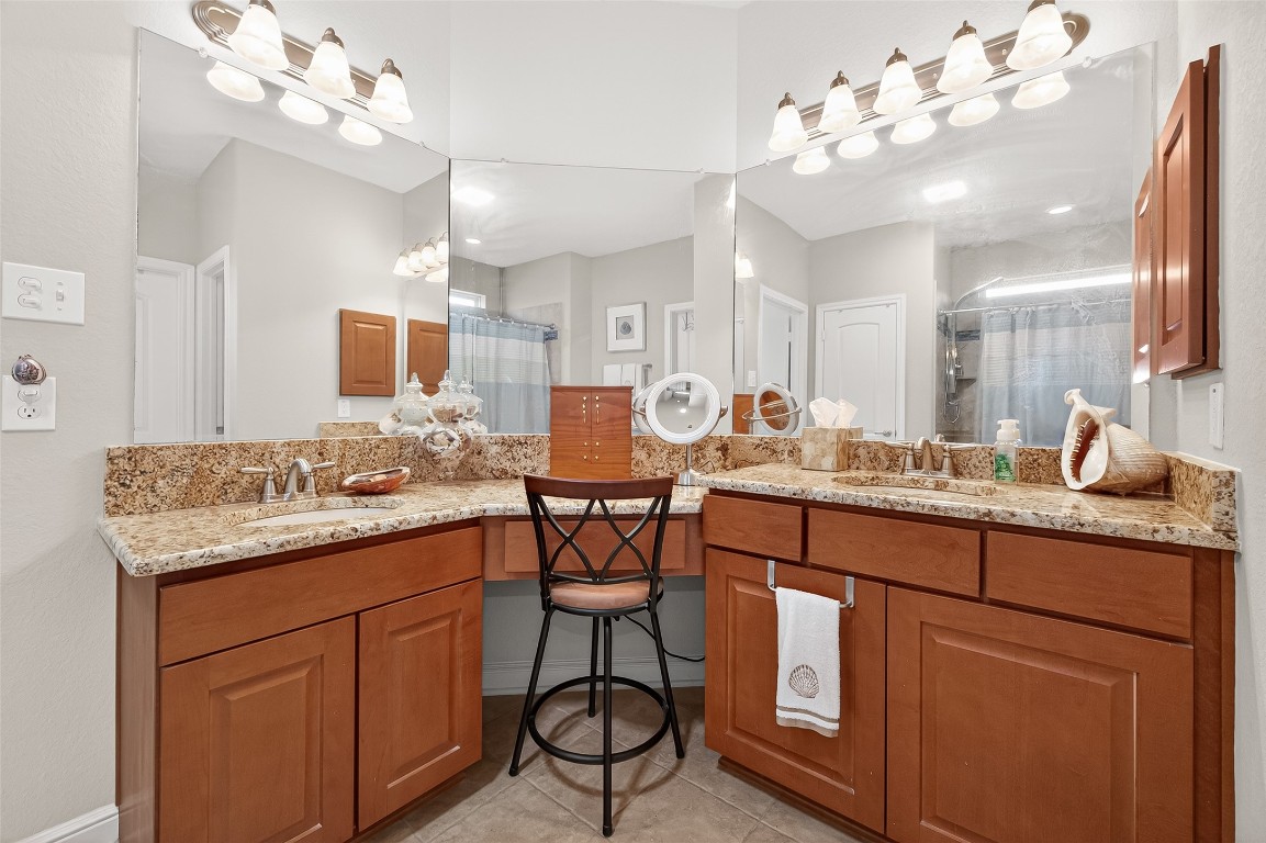 2719 Intrepid Trail Rosenberg, TX 77471 - Photo 37 of 50 a kitchen with center island cabinets and chandelier