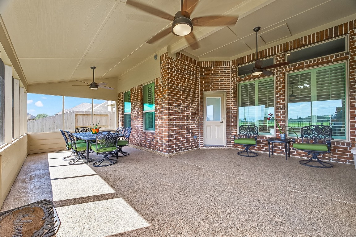 2719 Intrepid Trail Rosenberg, TX 77471 - Photo 43 of 50 a view of a patio with a table and chairs