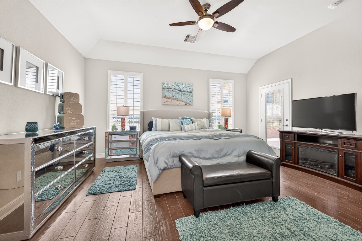 2719 Intrepid Trail Rosenberg, TX 77471 - Photo 5 of 50 a bedroom with a bed and a flat screen television