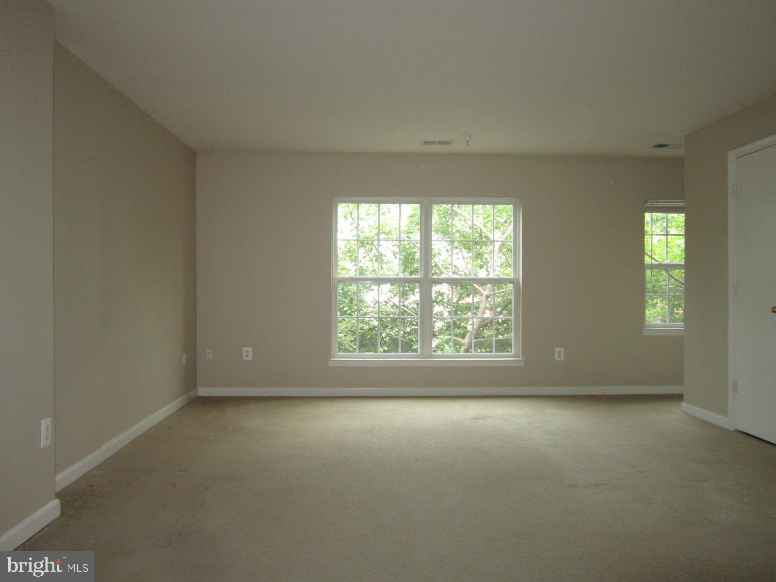 13972 Lullaby Road, Unit 4 Germantown, MD 20874 - Photo 5 of 18 Another Living Room View Showing Large Windows