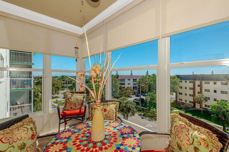 4751 Northwest 21st Street, Unit 504 Lauderhill, FL 33313 - Photo 24 of 27 a outdoor living space with patio furniture