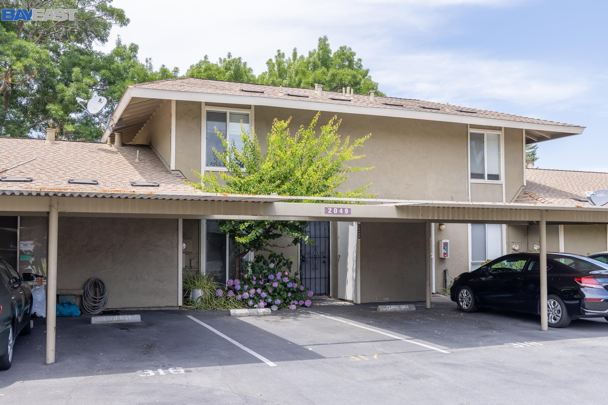 2049 Olivera Road, Unit B Concord, CA 94520 - Photo 1 of 1 a front view of a house with yard