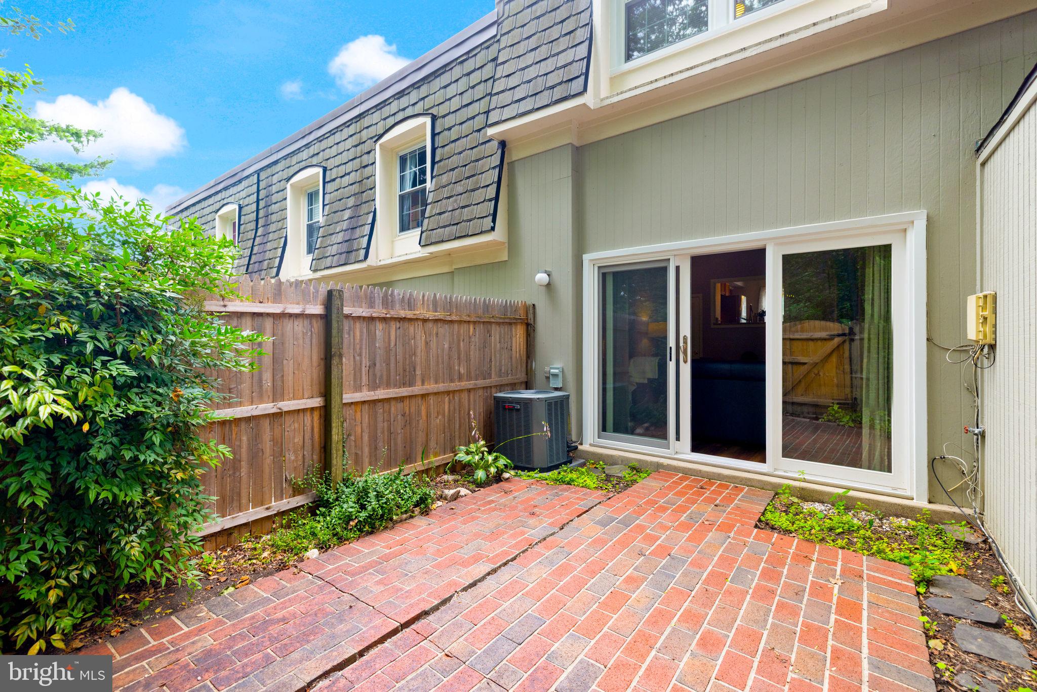 8204 Tory Road, Unit 136 Springfield, VA 22152 - Photo 29 of 36 a front view of a house with a garden