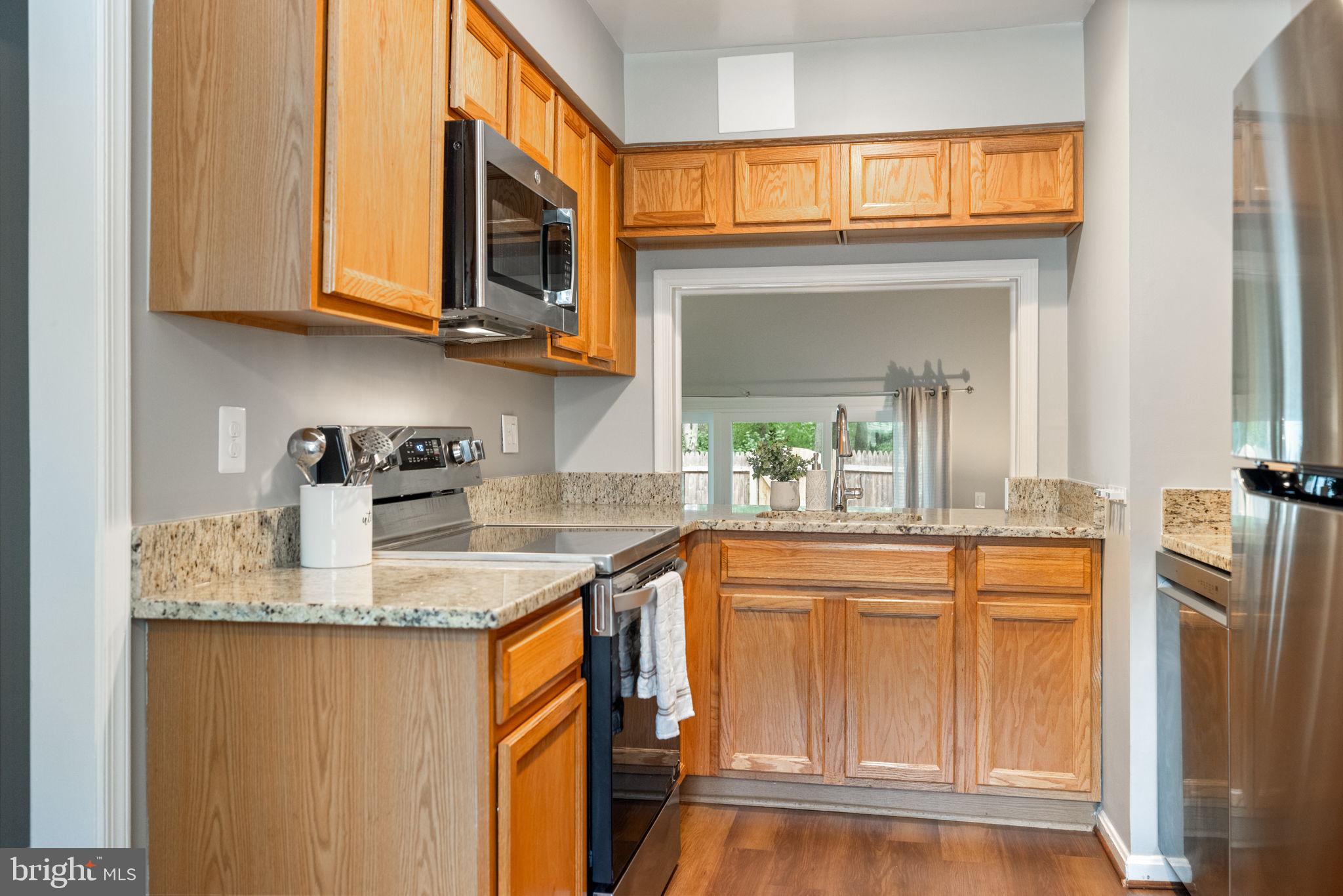 8204 Tory Road, Unit 136 Springfield, VA 22152 - Photo 8 of 36 a kitchen with stainless steel appliances granite countertop a sink and a cabinets