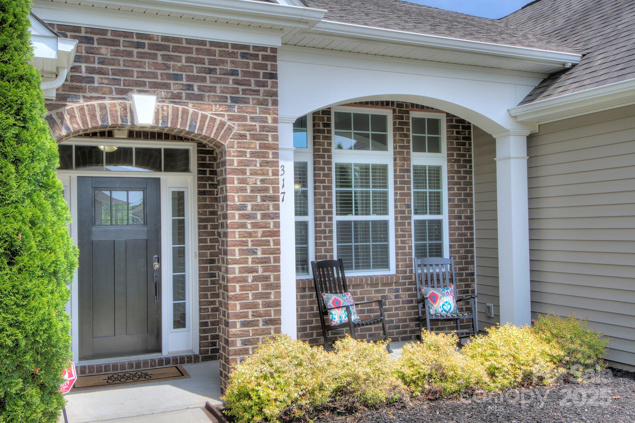 317 Annatto Way Tega Cay, SC 29708 - Photo 4 of 44 a front view of a house with a yard