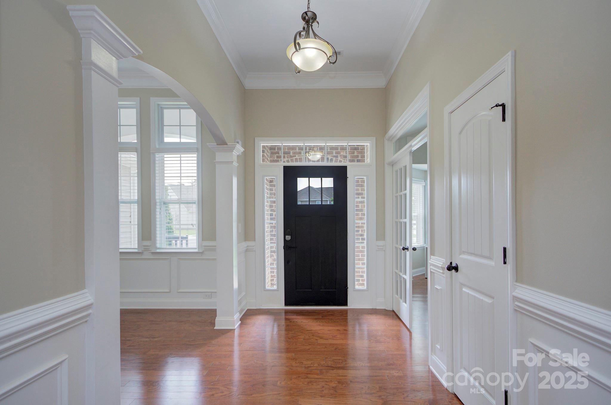 317 Annatto Way Tega Cay, SC 29708 - Photo 5 of 44 wooden floor in an empty room with a window