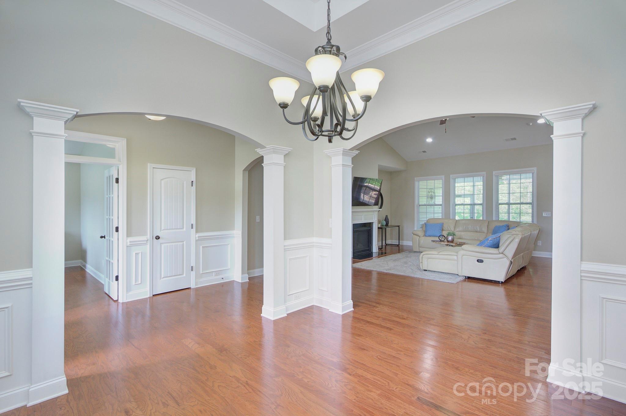 317 Annatto Way Tega Cay, SC 29708 - Photo 8 of 44 a view of a livingroom with furniture wooden floor chandelier