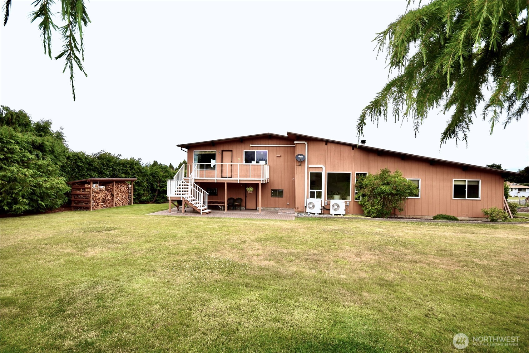 330 East Anderson Road Sequim, WA 98382 - Photo 2 of 33 a house that has a big yard with large trees