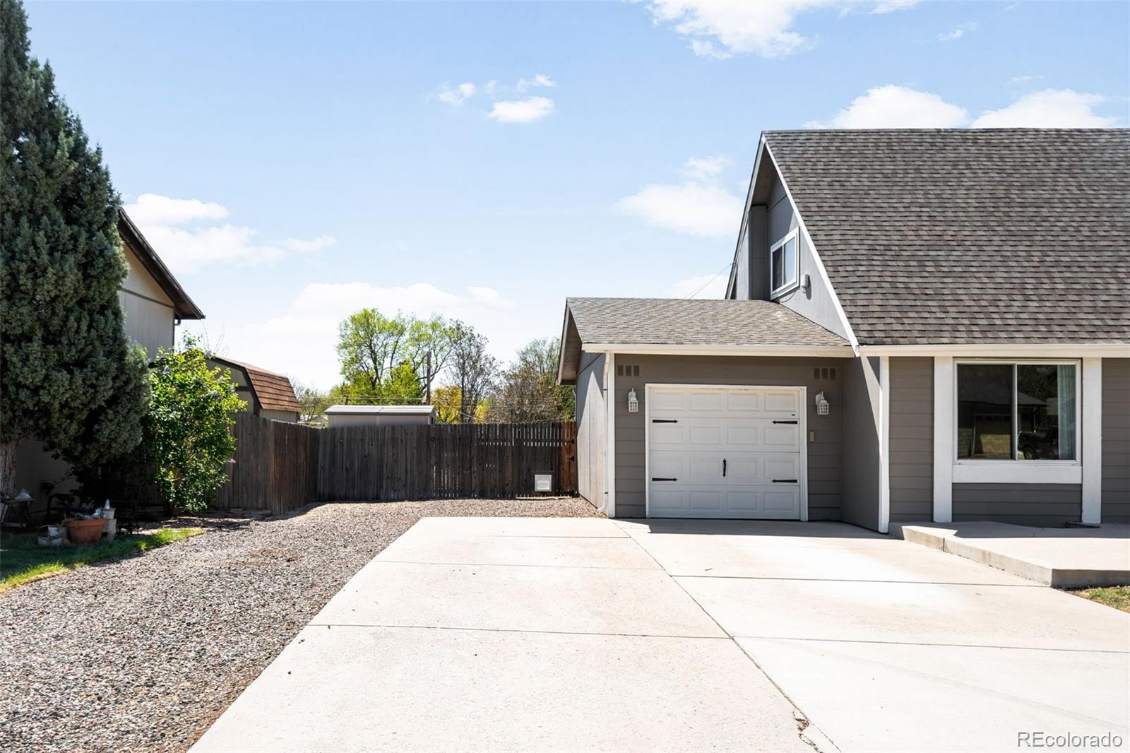 7186 West 79th Drive Arvada, CO 80003 - Photo 4 of 43 a house view with a outdoor space
