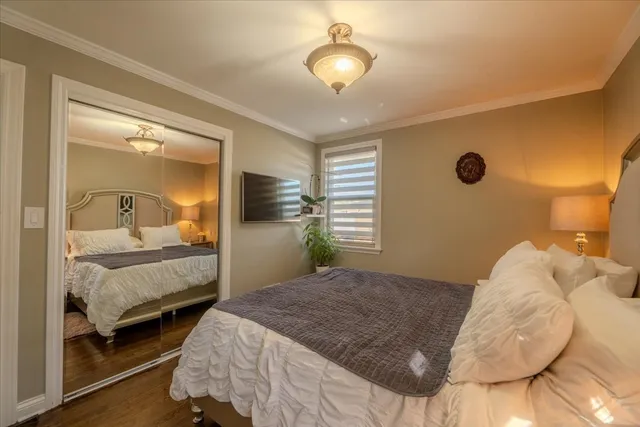 a bedroom with a bed and a mirror