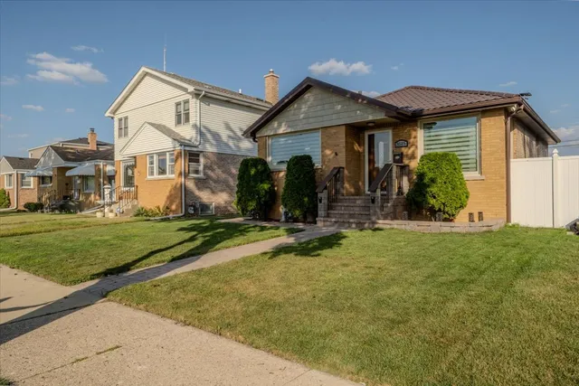 a view of house with yard