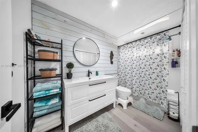 a bedroom with a bed and a walk in closet