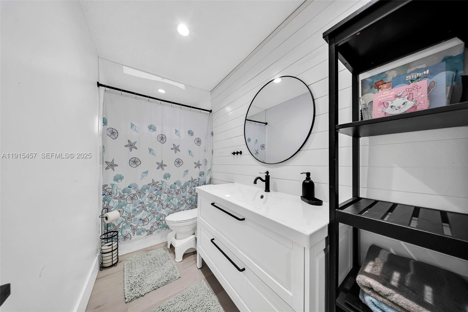 10431 Southwest 93rd Street Miami, FL 33176 - Photo 21 of 76 a bathroom with a sink a mirror and a shower