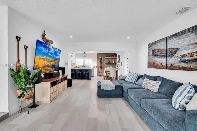 an aerial view of a house a yard swimming pool and outdoor seating