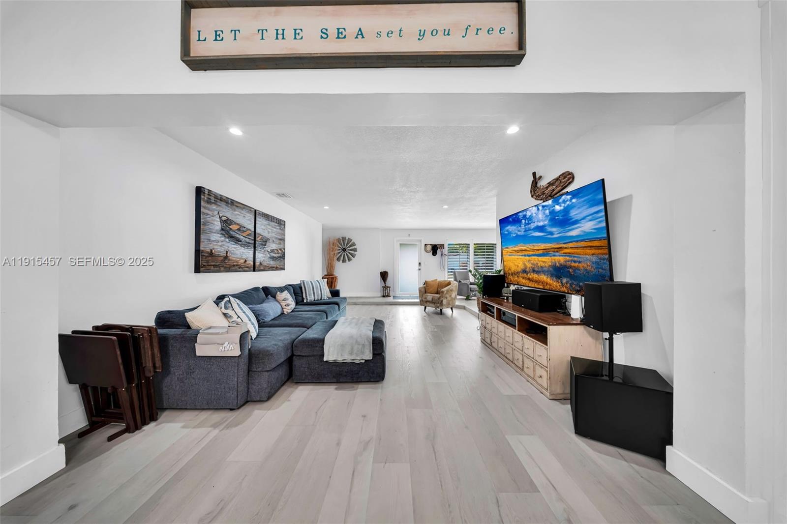 10431 Southwest 93rd Street Miami, FL 33176 - Photo 29 of 76 a living room with furniture and a flat screen tv