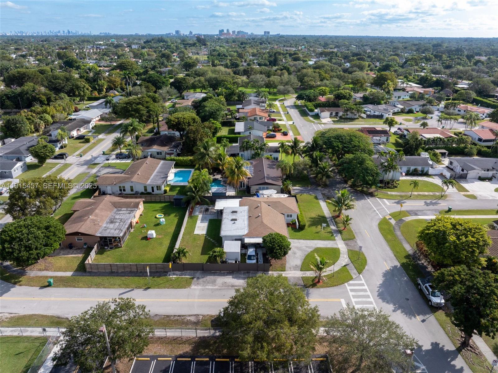 10431 Southwest 93rd Street Miami, FL 33176 - Photo 39 of 76 an aerial view of residential houses with outdoor space and city view