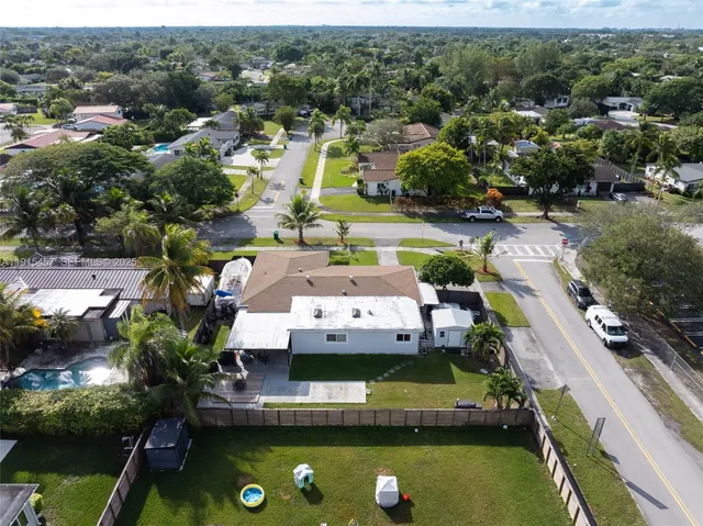 a bedroom with two beds and a large window