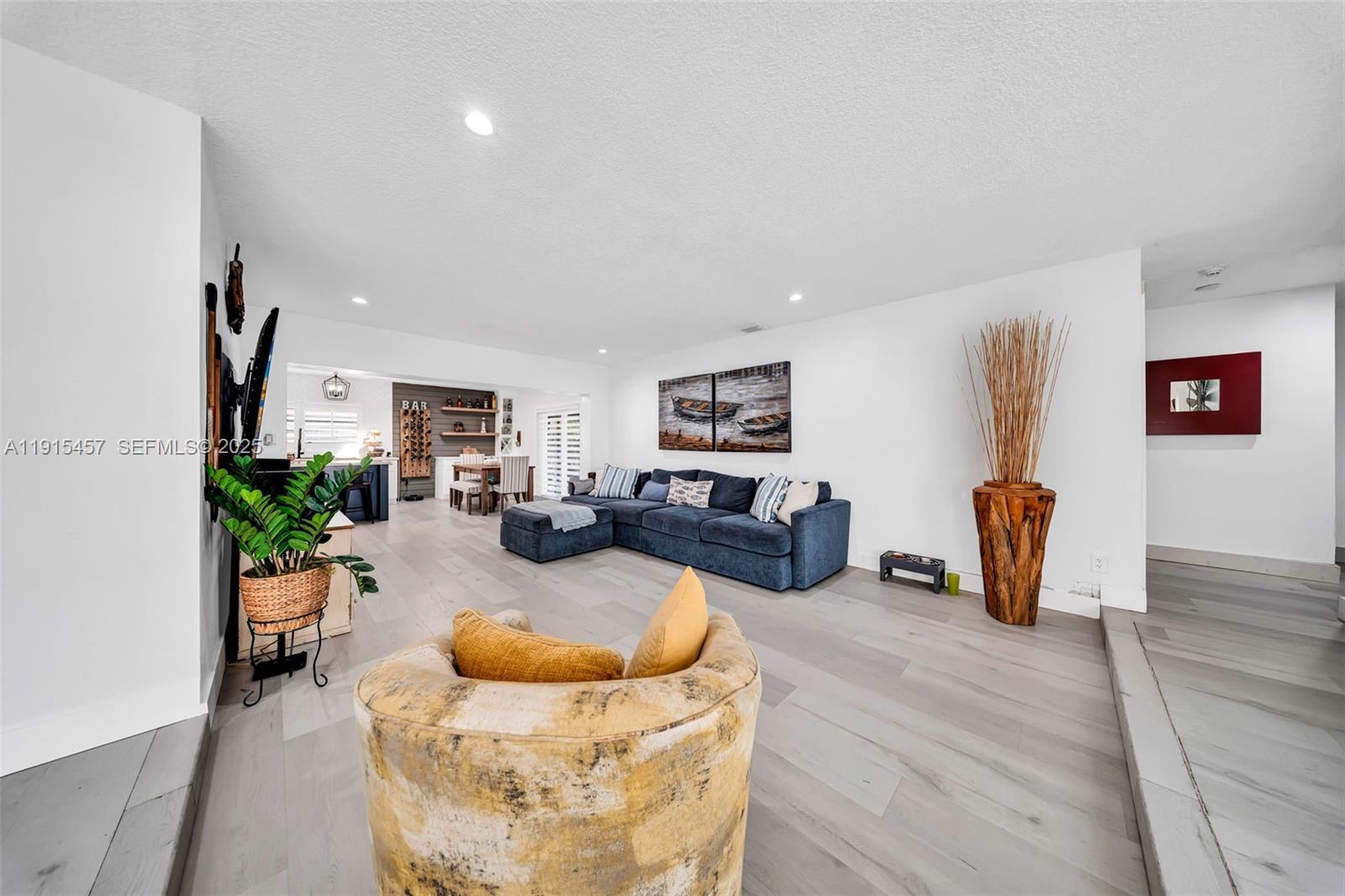 10431 Southwest 93rd Street Miami, FL 33176 - Photo 9 of 76 a living room with furniture and a wooden floor