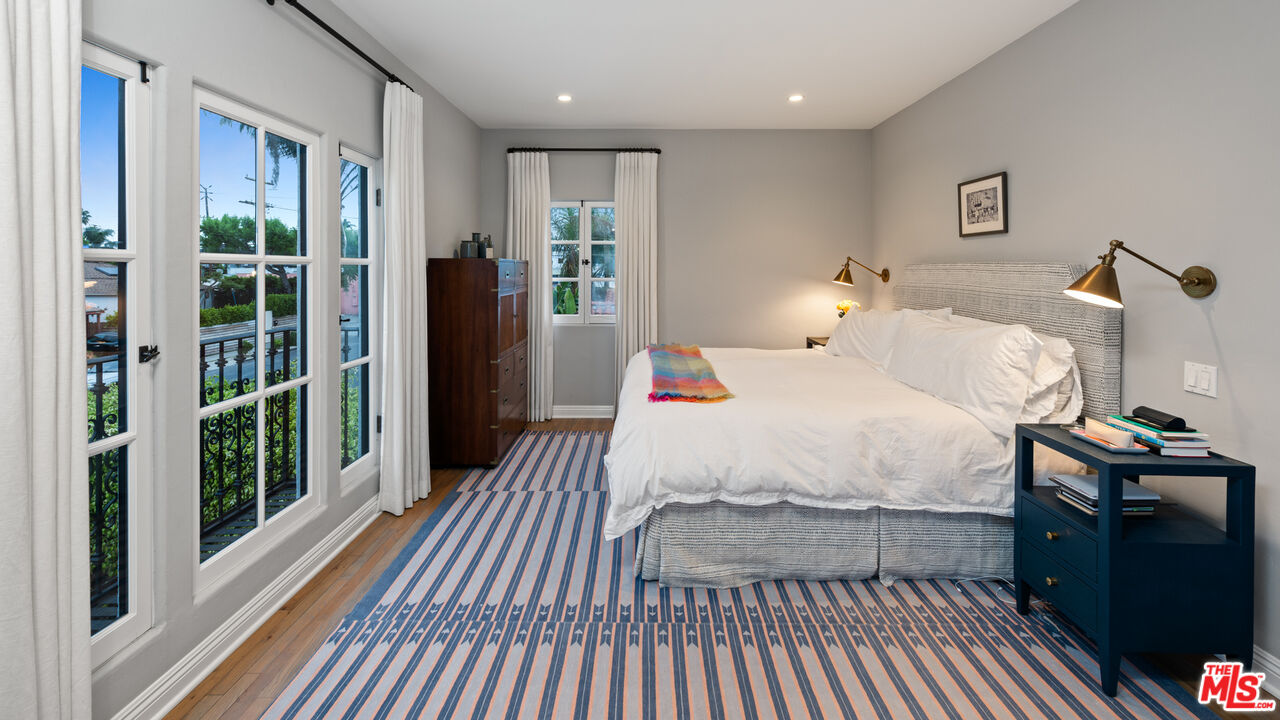 1146 Grant Avenue Venice, CA 90291 - Photo 13 of 20 a bedroom with a bed and wooden floor